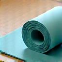 Lightweight resistance bands and a yoga mat rolled up